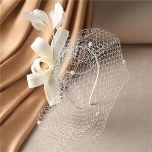 Elegant Cream Fascinator with Veil